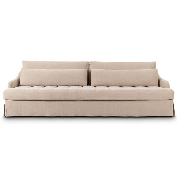 Sofa tapicerowana o lekkiej bryle z eleganckim profilem w odcieniu bezu