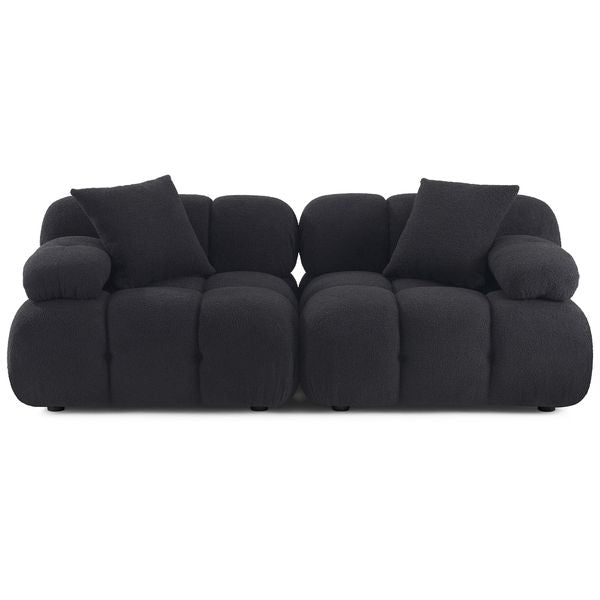 Sofa tapicerowana o prostej sylwetce z dopracowana sylwetka w odcieniu czerni