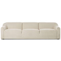 Sofa tapicerowana o subtelnym charakterze z oszczednym detalem w odcieniu bieli