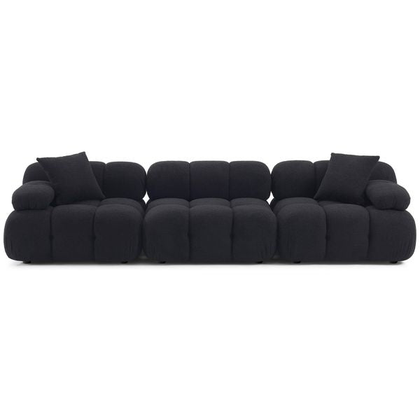 Sofa tapicerowana o harmonijnych proporcjach z delikatnym akcentem w odcieniu czerni